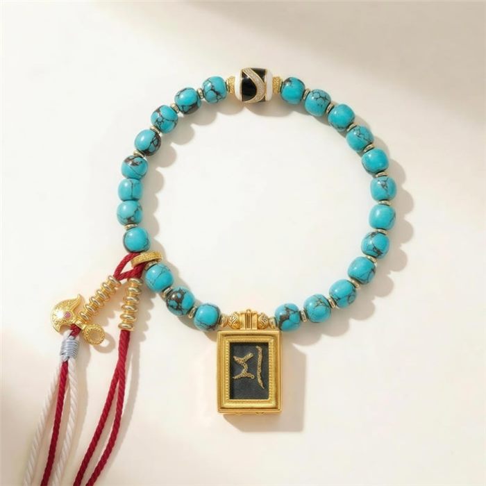 KyLin Aura turquoise bead bracelet with a framed Marici seed syllable charm and vajra accent