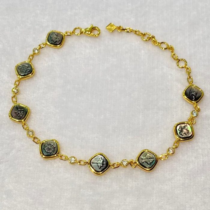 Tibetan Ashtamangala sterling silver bracelet with gold-plated finish